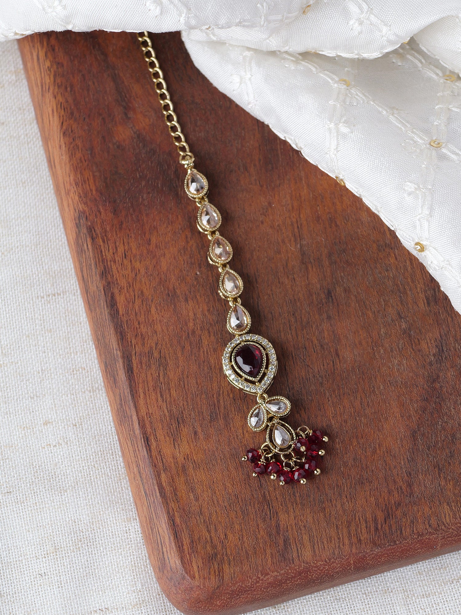 Aditi Maang Tikka in Maroon and Antique Gold