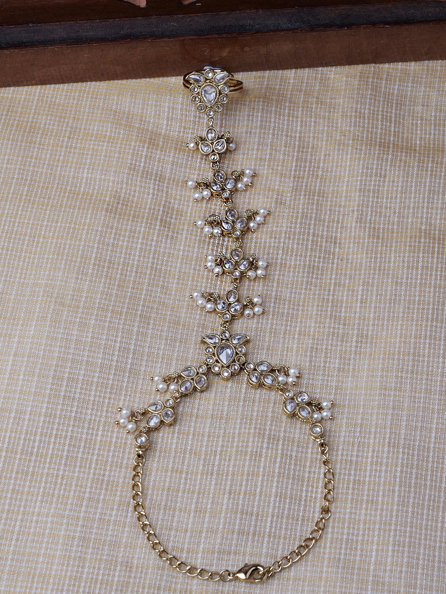 Ishita Hand Chain in Pearl and White