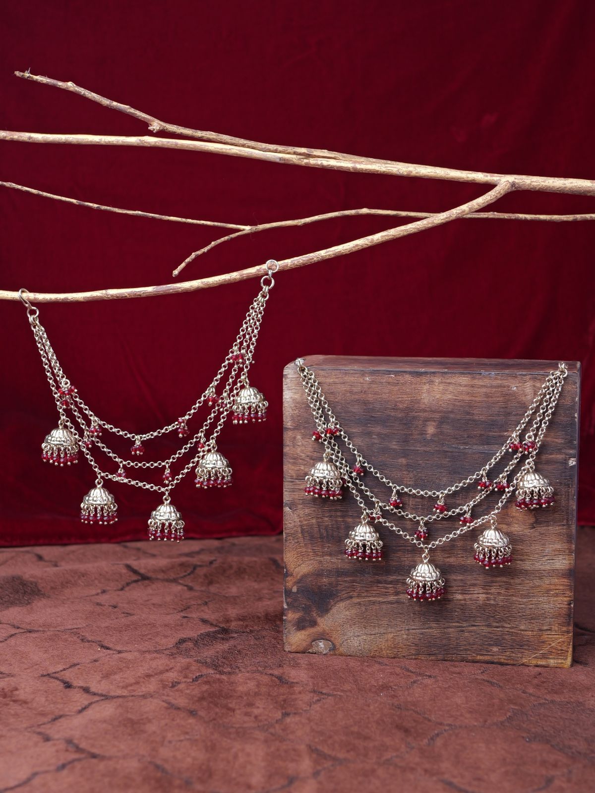 Jhumka and Pearl Layered Ear Chains in Maroon