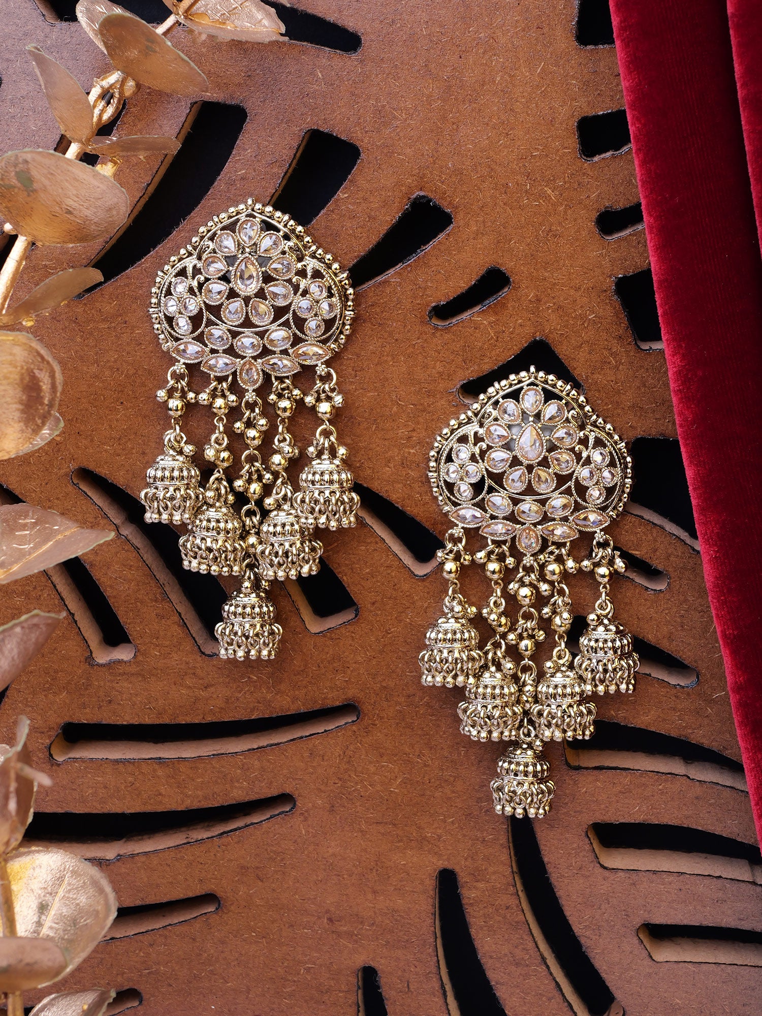 Kimaya Long Jhumka Earrings in Antique Gold