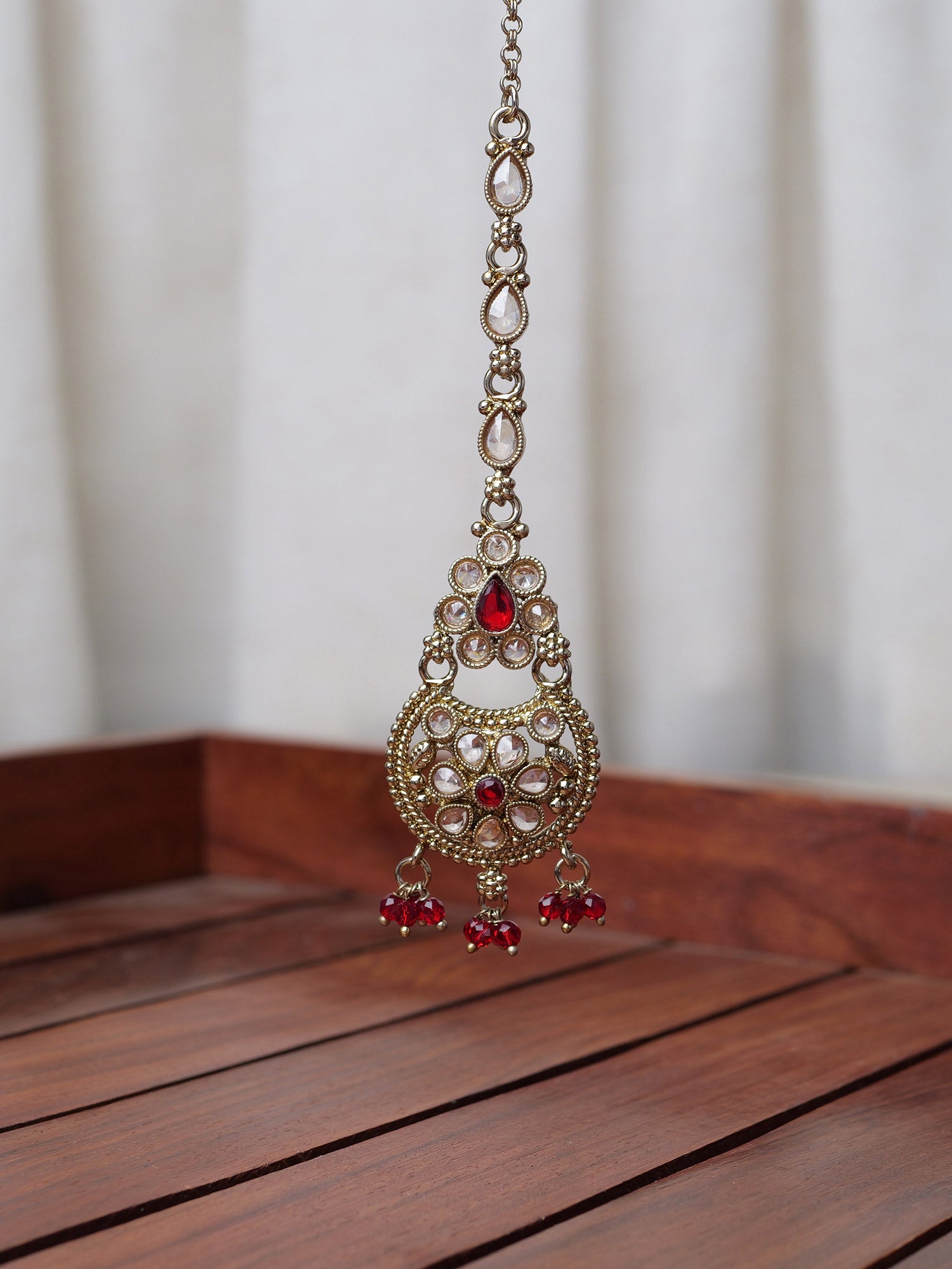 Saara Maang Tikka in Maroon and Antique Gold