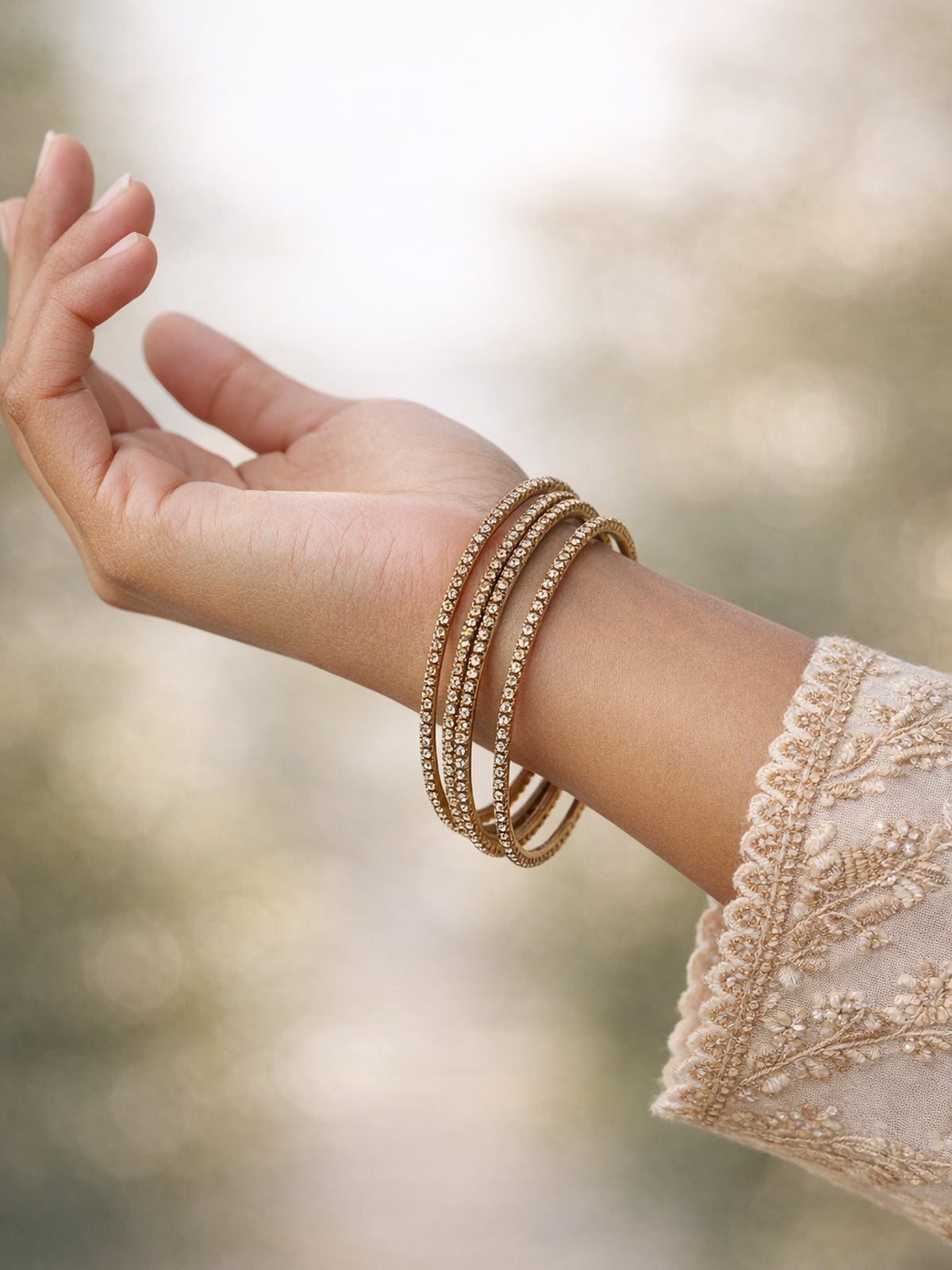 Set of 4 Diamante Bangles in Champagne