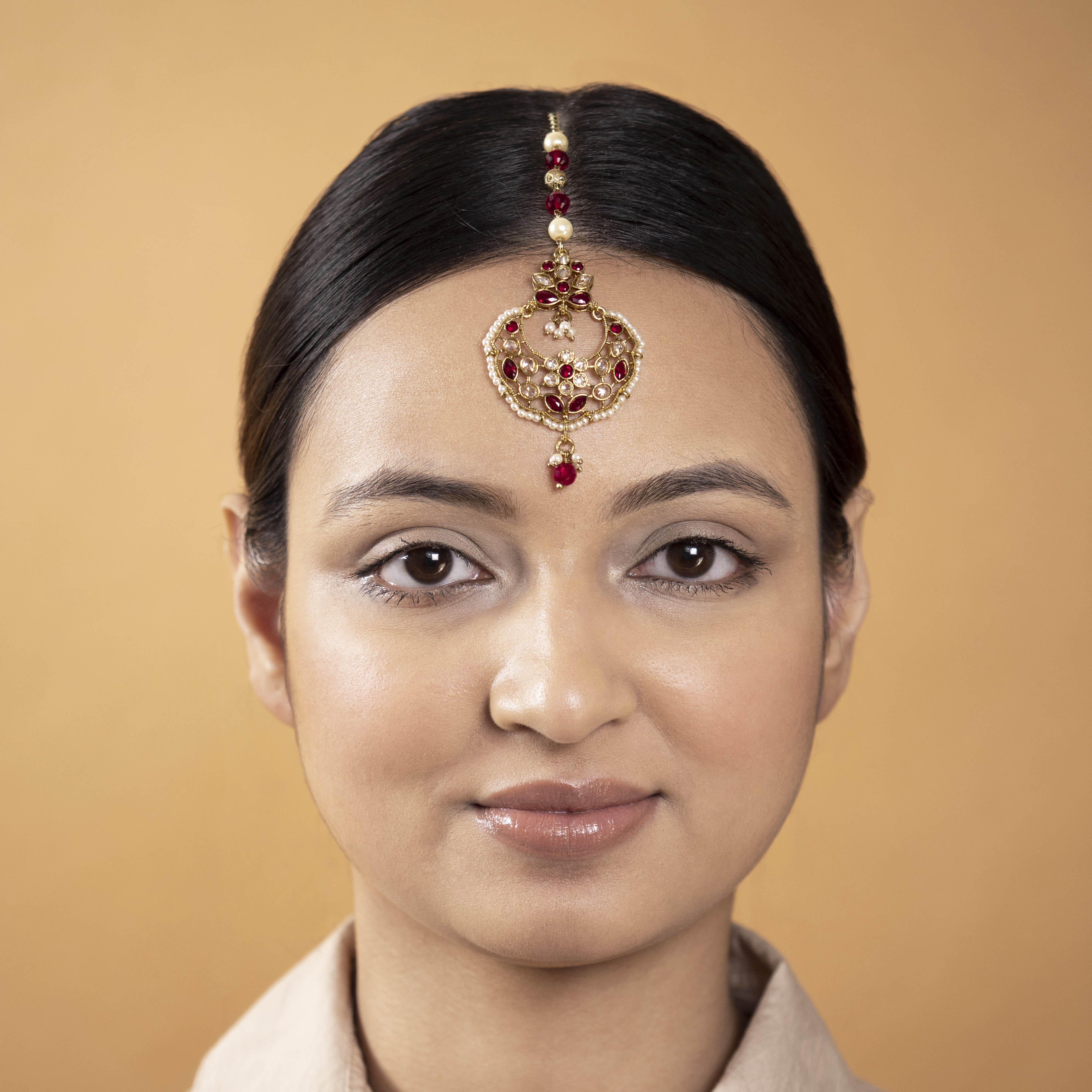 Eshika Tikka in Maroon