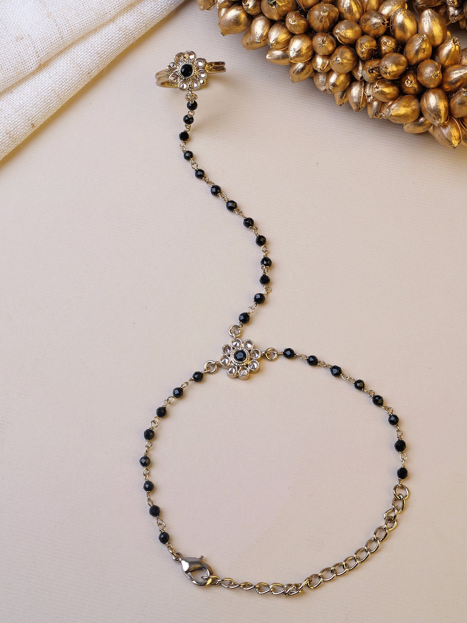 Forever Floral Hand Chain in Black and Antique Gold